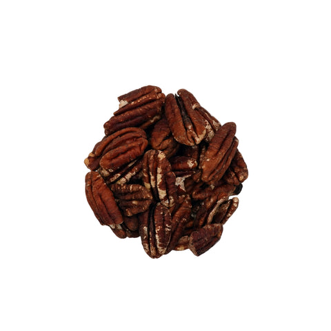 A top-down view of unsalted pecans inside a clear glass bowl, set against a plain white background.