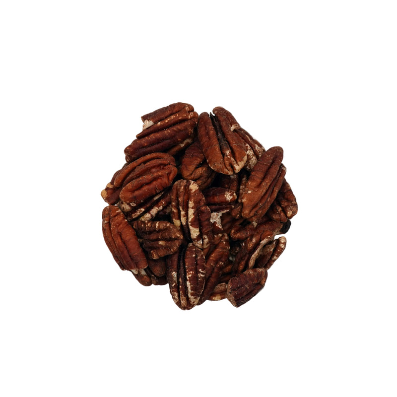 A top-down view of unsalted pecans inside a clear glass bowl, set against a plain white background.