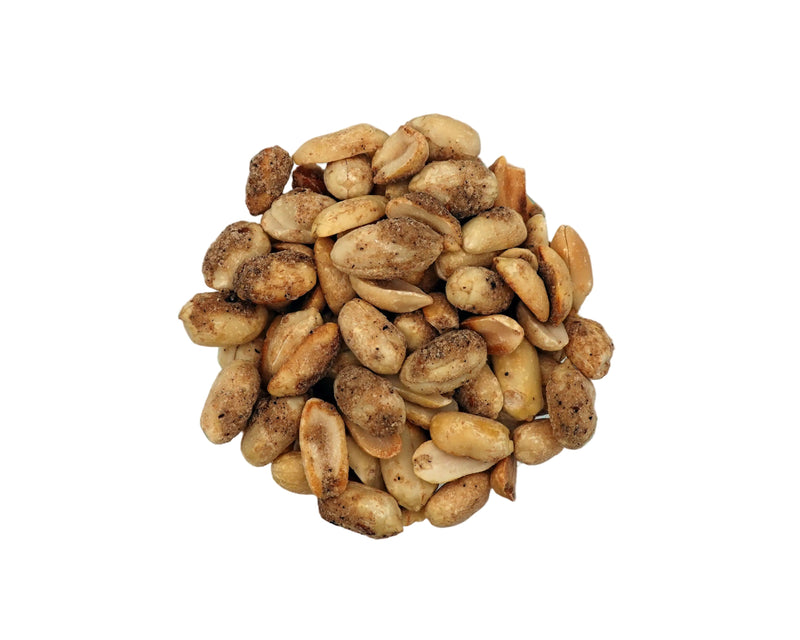 Roasted peanuts in a clear glass bowl, photographed from a top-down view on a clean white background.